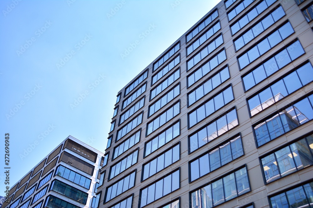 The windows of a modern building for offices. Business buildings architecture.