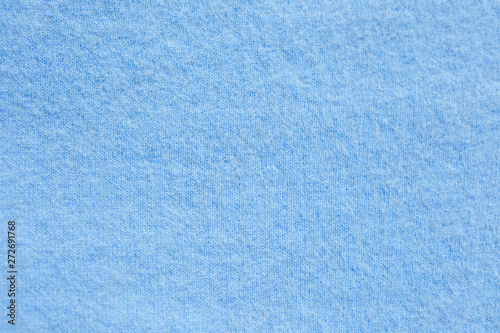 Background texture of blue pattern knitted fabric made of cotton or wool. close up
