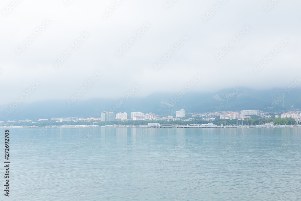 Evening landscape of the Black Sea, calm water and the evening sky in the city of Gelendzhik, Russia Evening landscape of the Black Sea, calm water and the evening sky in the city of Gelendzhik, Russia