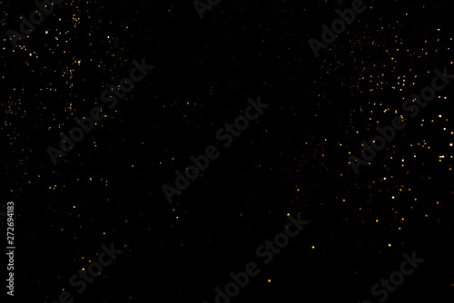 Gold abstract bokeh. Black background. Holyday concept