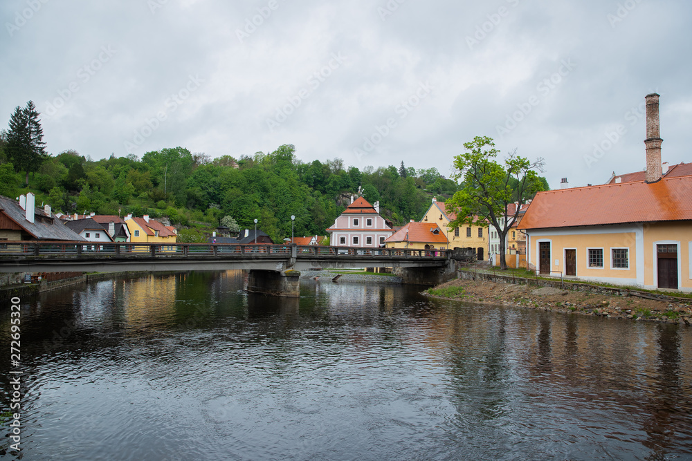 Panoramic landscape view on river Vltava in the historic city of Cesky Krumlov with famous Church city is on a UNESCO World Heritage Site captured during spring with nice sky and clouds Panoramic landscape view on river Vltava in the historic city of Cesky Krumlov with famous Church city is on a UNESCO World Heritage Site captured during spring with nice sky and clouds