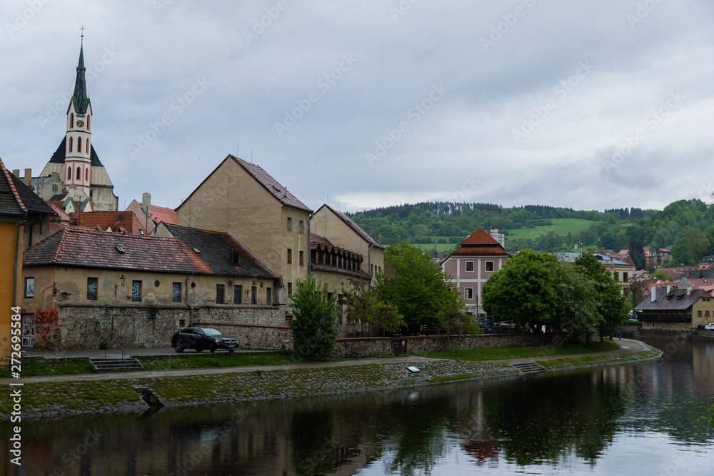 Panoramic landscape view on river Vltava in the historic city of Cesky Krumlov with famous Church city is on a UNESCO World Heritage Site captured during spring with nice sky and clouds Panoramic landscape view on river Vltava in the historic city of Cesky Krumlov with famous Church city is on a UNESCO World Heritage Site captured during spring with nice sky and clouds