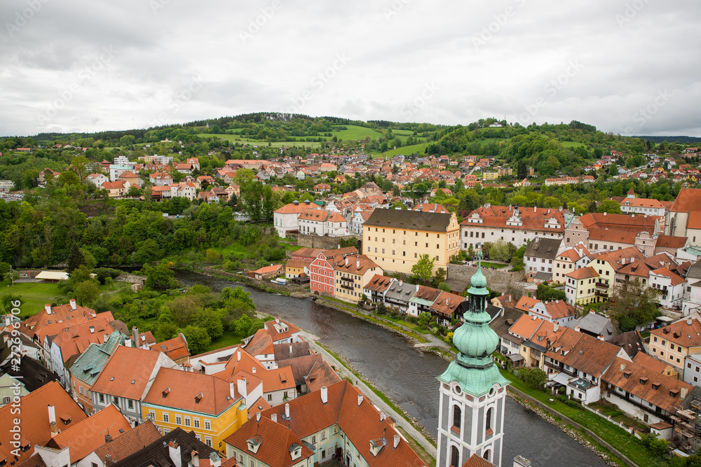 Panoramic landscape view above from aerial of the historic city of Cesky Krumlov with famous Cesky Krumlov Castle, Church city is on a UNESCO World Heritage Site captured during the spring