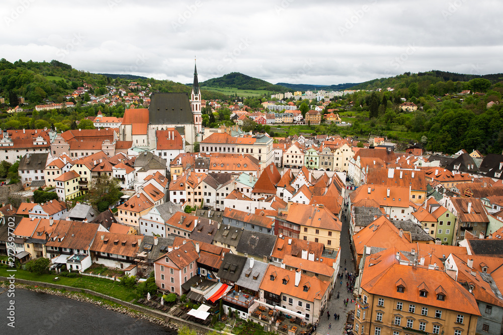 Fototapeta premium Panoramic landscape view above from aerial of the historic city of Cesky Krumlov with famous Cesky Krumlov Castle, Church city is on a UNESCO World Heritage Site captured during the spring