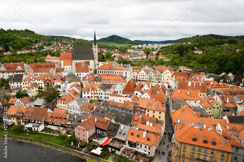 Panoramic landscape view above from aerial of the historic city of Cesky Krumlov with famous Cesky Krumlov Castle, Church city is on a UNESCO World Heritage Site captured during the spring