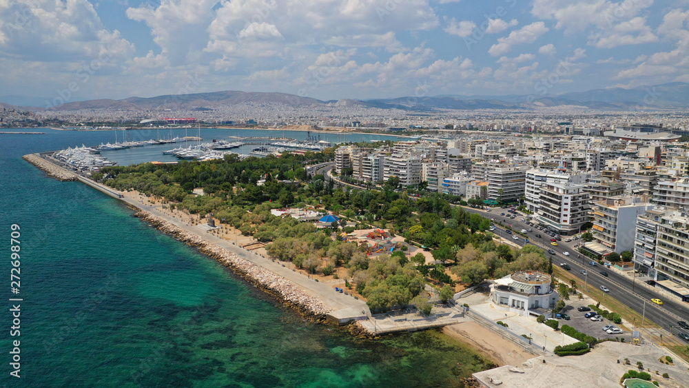 Aerial panoramic photo of famous seaside bay of Faliro with beautiful emerald sea, clouds and deep blue sky