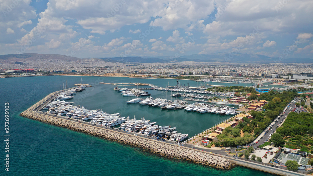Aerial panoramic photo of famous seaside bay of Faliro with beautiful emerald sea, clouds and deep blue sky