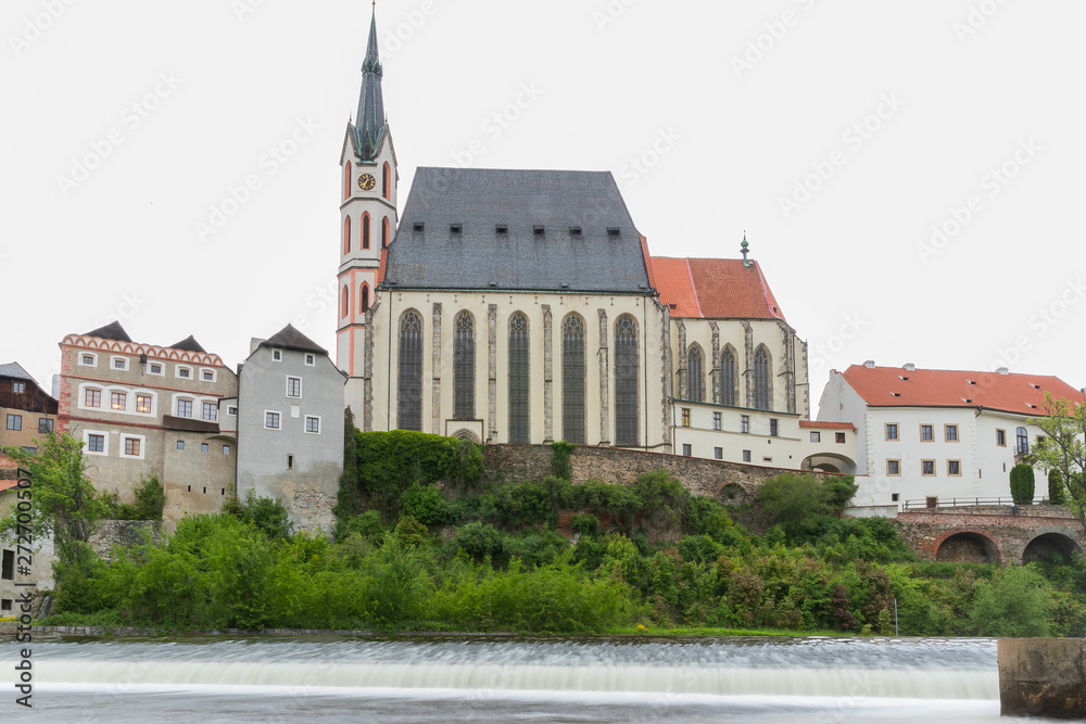 Panoramic landscape view of the historic city of Cesky Krumlov with famous Church city is on a UNESCO World Heritage Site captured during spring with nice sky and clouds