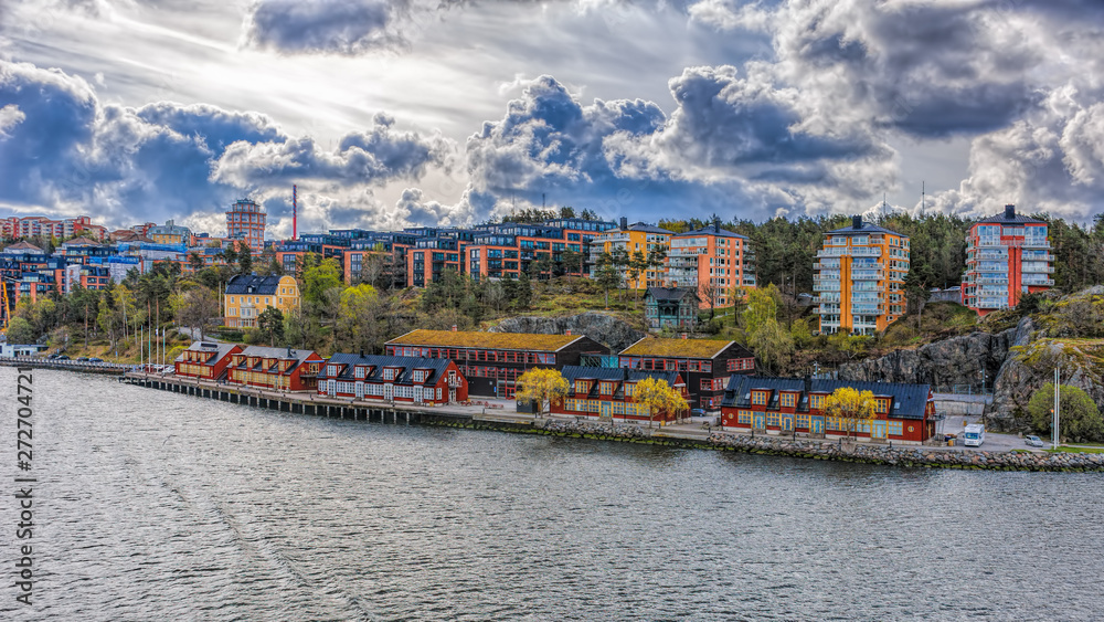 Vintage wooden renovated storehouses painted in traditional falun red