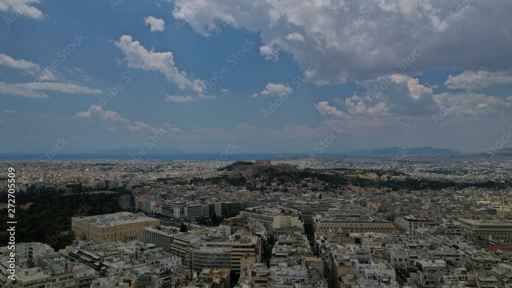 Aerial photo of Athens Metropolis urban area and iconic Acropolis hill and the Parthenon, Attica, Greece