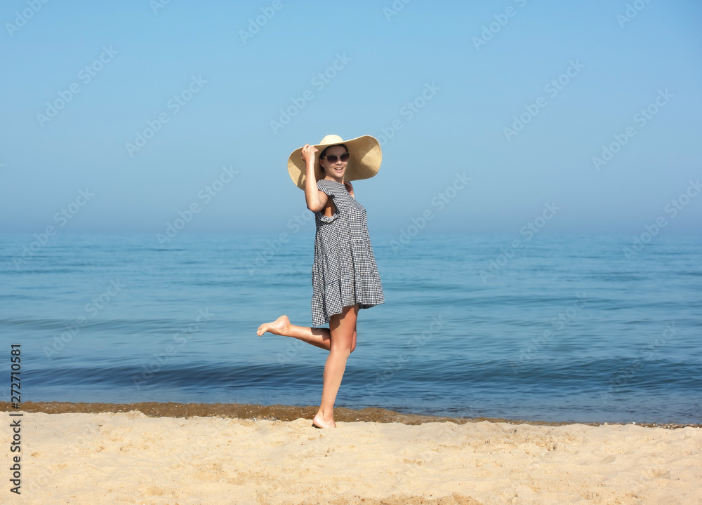 Happy woman enjoying beach relaxing joyful in summer by blue water. Happy woman enjoying beach relaxing joyful in summer by blue water.