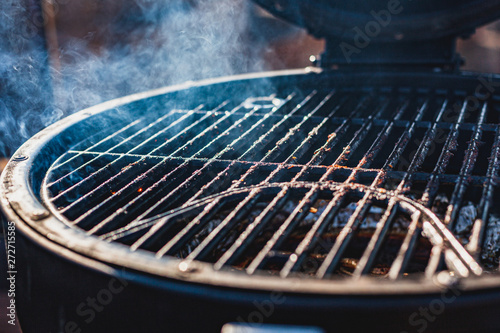 Close up of smoking empty barbeque grill © J.Pliacushok