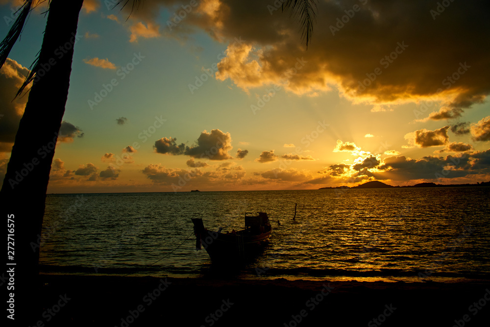 Sunrise about sea with boat in Thailand
