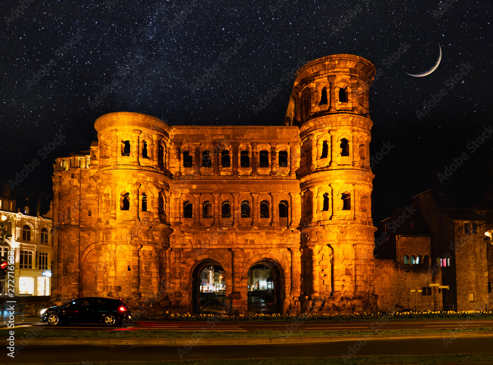 View on Porta Nigra (antique Roman gate) at night with stars and moon
