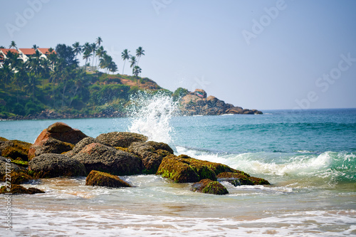 Ocean coast with big waves and rocks photo