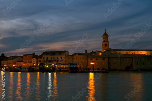 Nocturnal view of waterfront town of Krk. Summer seascape of Adriatic sea. Island Krk, Croatia.-