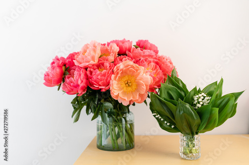 Wallpaper Mural Coral peonies and spring lilies of the valley in a glass vase on wooden table.. Beautiful peony flower for catalog or online store. Floral shop concept . Beautiful fresh cut bouquet. Flowers delivery. Torontodigital.ca