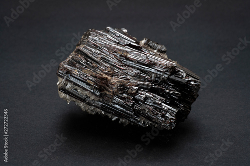 Piece of Hubnerite mineral from Pasto Bueno, Peru. A mineral consisting of manganese tungsten oxide with black monoclinic prismatic submetallic crystals with fine striations. photo