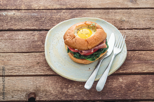 Homemmade Bacon Hamburger with Egg Lettuce and Tomato photo