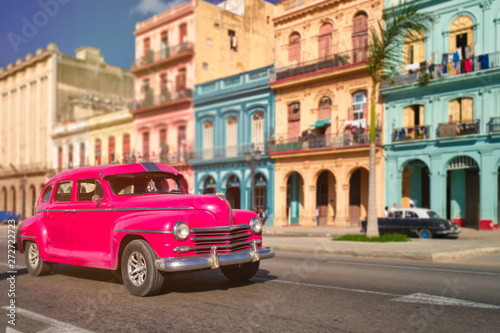 Antique car and colorful buildings in old Havana