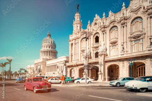 Antique cars next to the Capitol and the Grand Theater of Havana © kmiragaya
