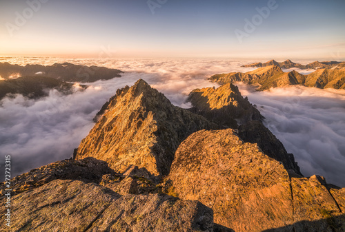 Fototapeta Naklejka Na Ścianę i Meble -  Mountains Landscape with Inversion in the Valley at Sunset as seen From Rysy Peak in High Tatras, Slovakia
