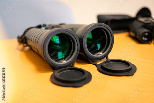 binoculars on yellow background birds discover watching glaaass looking optical object magnification glasses telescope camera spy zoom view from far technology isolated equipment gear prism adventure