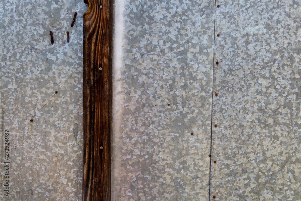 rusty metal gates with hinges, nails and rivets rusty metal gates with hinges, nails and rivets