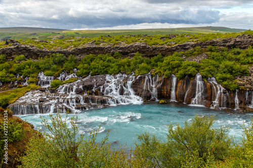 Hraunfossar waterfall powerful streams falling into Hvita river turquoise waters  Husafell  Western Iceland