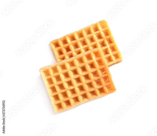 Delicious waffles for breakfast on white background, top view