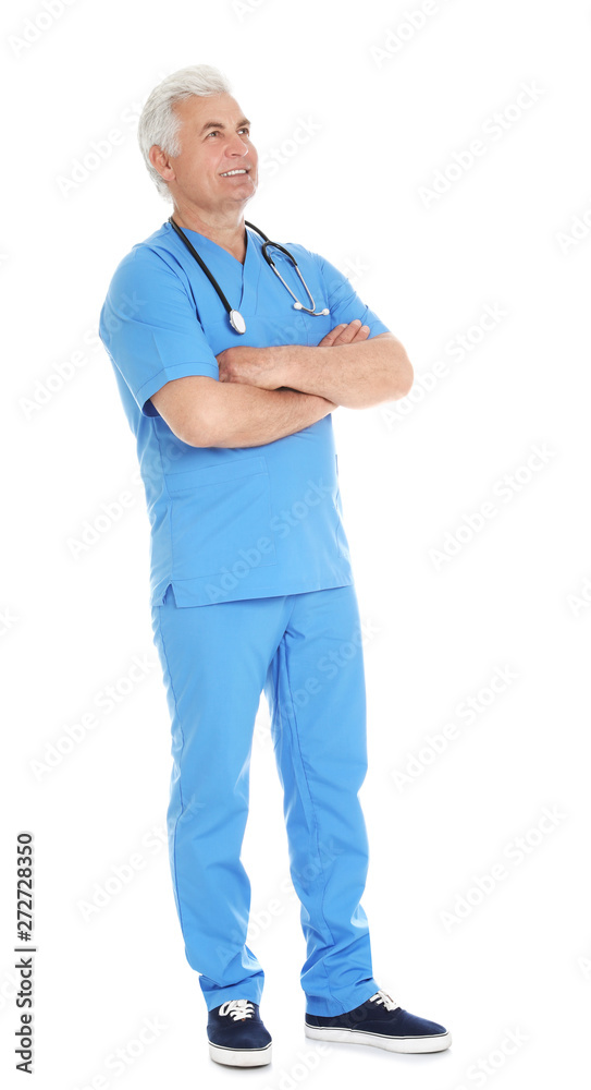 Full length portrait of male doctor in scrubs with stethoscope isolated on white. Medical staff Full length portrait of male doctor in scrubs with stethoscope isolated on white. Medical staff