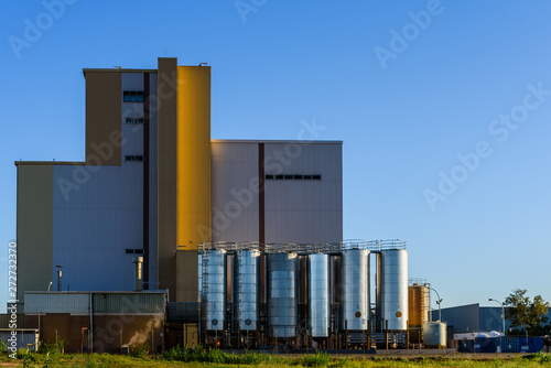 Valencia  Spain - May 29  2019  Industrial factory with large metal tanks to store liquids and supplies in an industrial estate on the outskirts of Valencia.