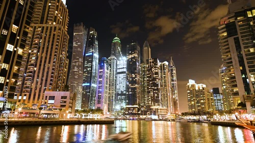 Wallpaper Mural Stunning time-lapse video of boats sailing on the artificial canal in Dubai Marina. Illuminated skyscrapers surround a beautiful promenade. Dubai, United Arab Emirates. Torontodigital.ca