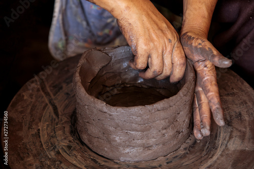 The Dirty hands of Potter's hands are molding tools made of clay.Concept of natural materials,
