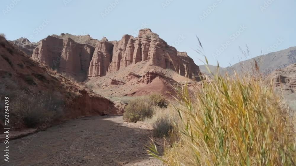 Small Creek Canyon with Red Cliffs named Konorcheck Canyon. Small canyon named Kyzyl Terek can be visited by walk. Great place to camp, hike explore on the way to Issyk Kul lake. Small Creek Canyon with Red Cliffs named Konorcheck Canyon. Small canyon named Kyzyl Terek can be visited by walk. Great place to camp, hike explore on the way to Issyk Kul lake.
