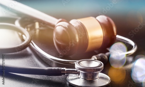 Judge gavel and stethoscope , close-up view photo