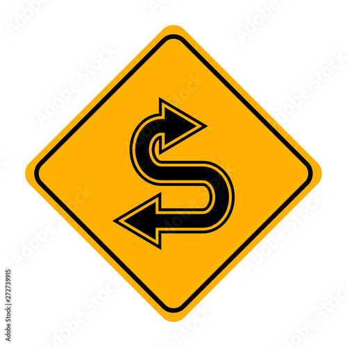 arrow road sign in yellow signage