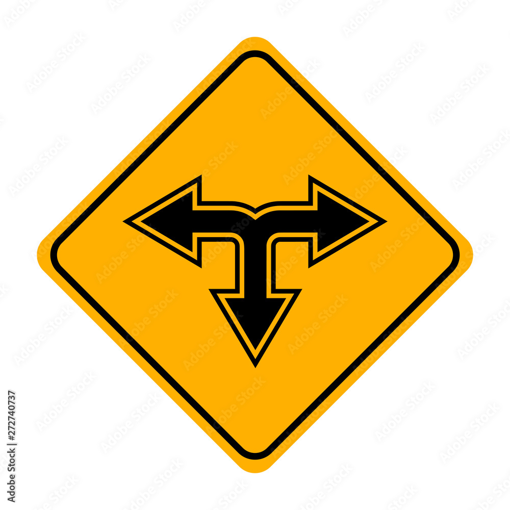 arrow road sign in yellow signage