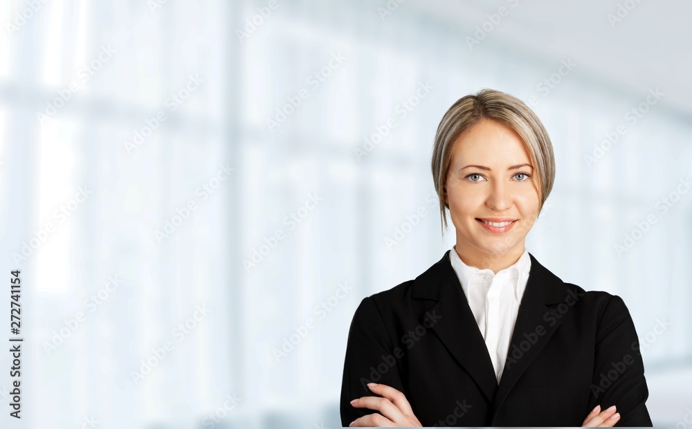 Mature businesswoman wearing formal suit on background Mature businesswoman wearing formal suit on background