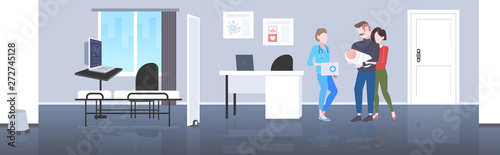 parents and newborn baby happy family and doctors couple post natal pediatrician consultation concept modern hospital clinic interior flat full length horizontal
