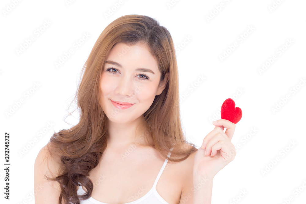 Portrait of beautiful asian young woman holding red heart shape pillow and smile isolated on white background, valentines day, holiday concept. Portrait of beautiful asian young woman holding red heart shape pillow and smile isolated on white background, valentines day, holiday concept.