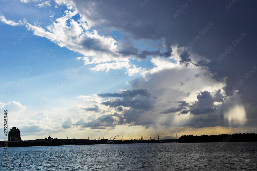 Ukraine. Dnieper. Thunderstorm approaching the city. Huge storm clouds, it is raining.