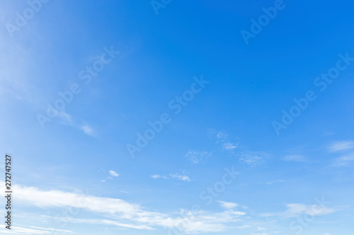blue sky background texture with white clouds. © Thinapob