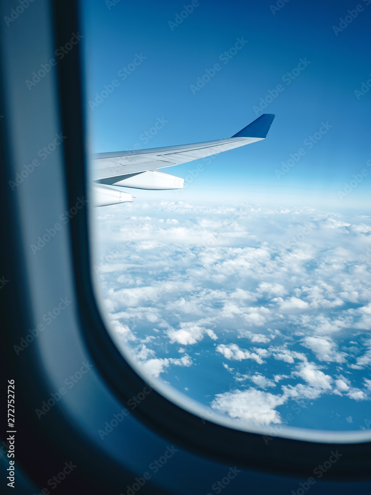 View from the plane. White clouds and blue sky from the airplane View from the plane. White clouds and blue sky from the airplane