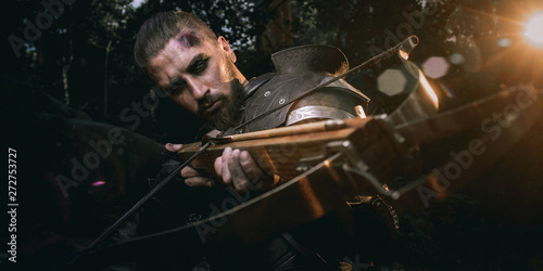 Billede på lærred Knight with sword and crossbow