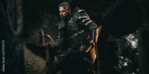 Fototapete Knight with sword and crossbow
