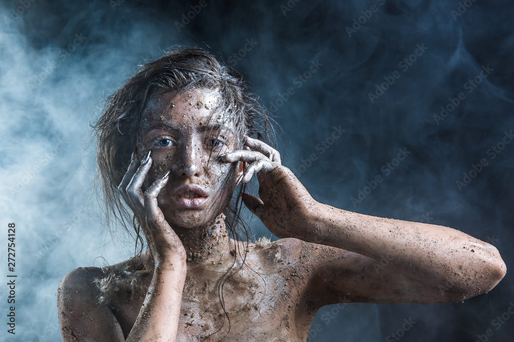 fashion portrait of a dark-skinned girl with silver foil make-up. Beauty face. fashion portrait of a dark-skinned girl with silver foil make-up. Beauty face.
