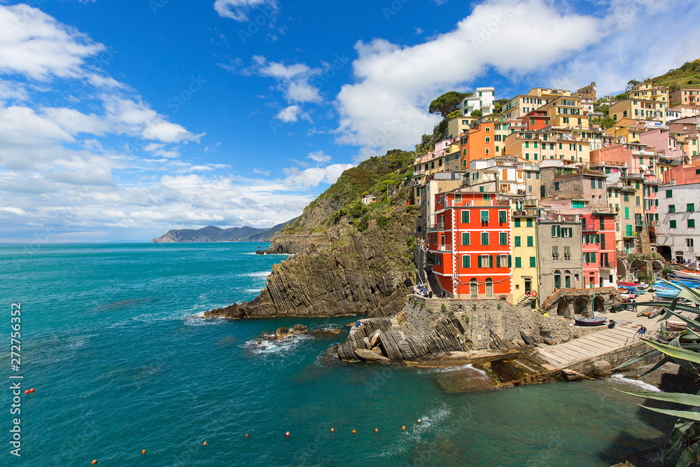 View on seaside and typical houses in small village, Riomaggiore, Cinque Terre, Italy