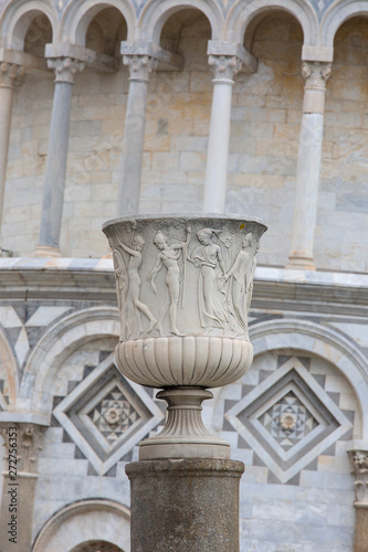 Decorative column on the background of Leaning Tower of Pisa and Pisa Cathedral, Piazza del Duomo