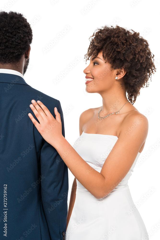 back view of african american bridegroom standing near happy bride isolated on white back view of african american bridegroom standing near happy bride isolated on white
